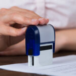 Notary public notarizing a legal document